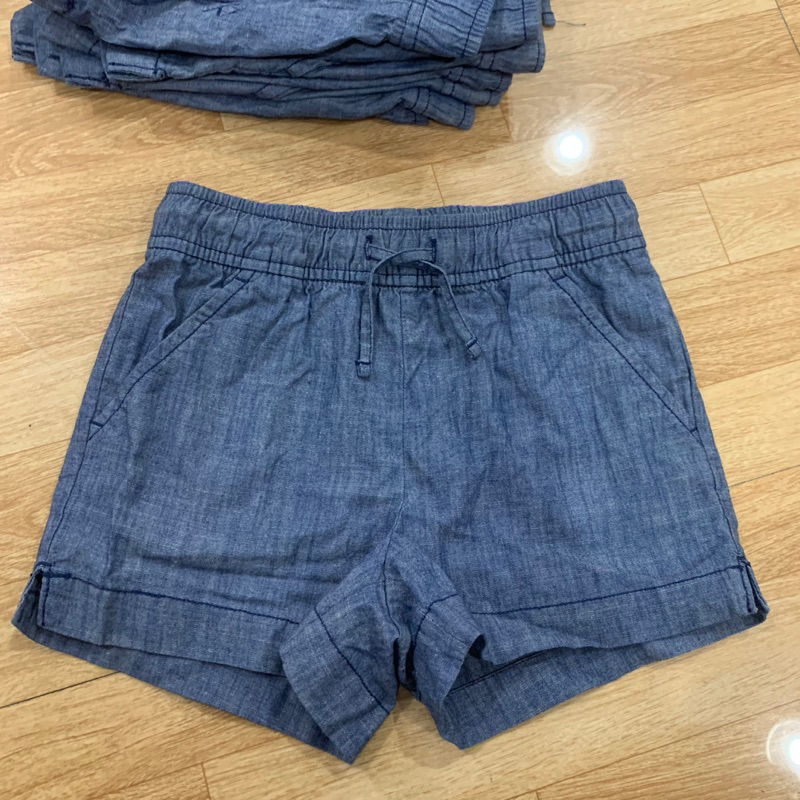 Quần short bò giấy bé gái, hàng dư