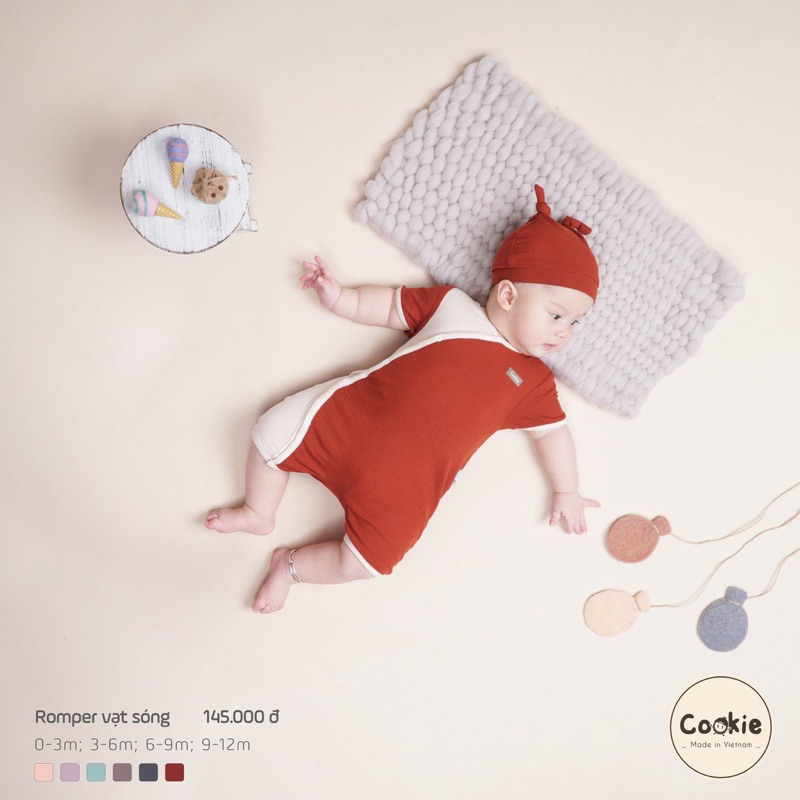 Body Romper đùi vạt sóng cookie cài lệch thun tăm mùa hè cho bé trai bé gái