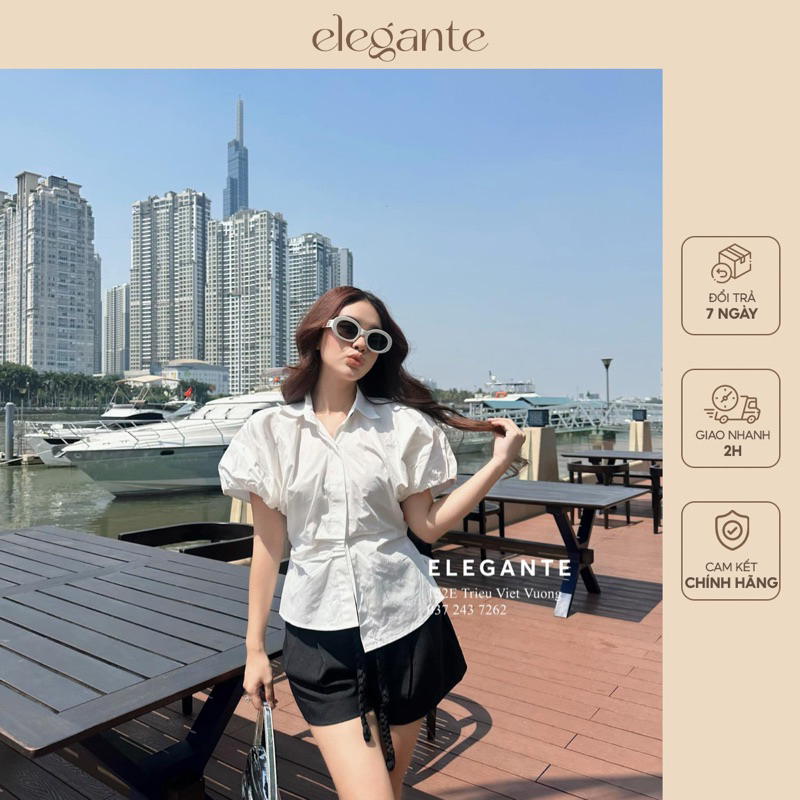 Áo sơ mi thô vạt lệch tay bồng 1 khuy đen Elegante 55050202 màu trắng trơn
