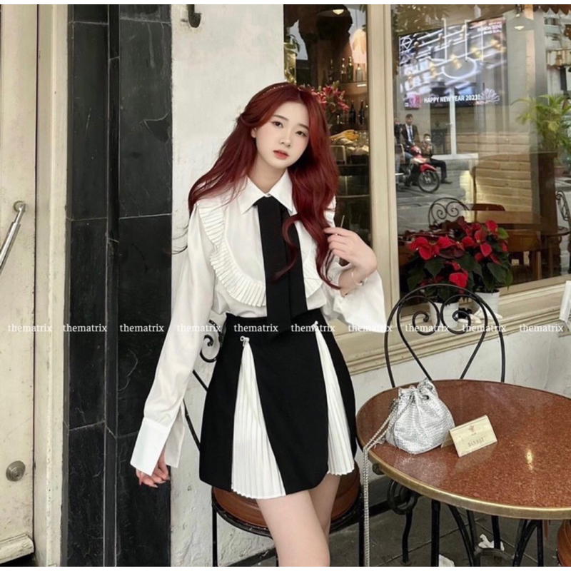 Mã Mới Sét Phối Đen Trắng Áo Sơ Mi Sẻ Tà Tay , Chân Váy Xếp Ly Trắng Tà Đen Tặng 2 cái Tang Đá