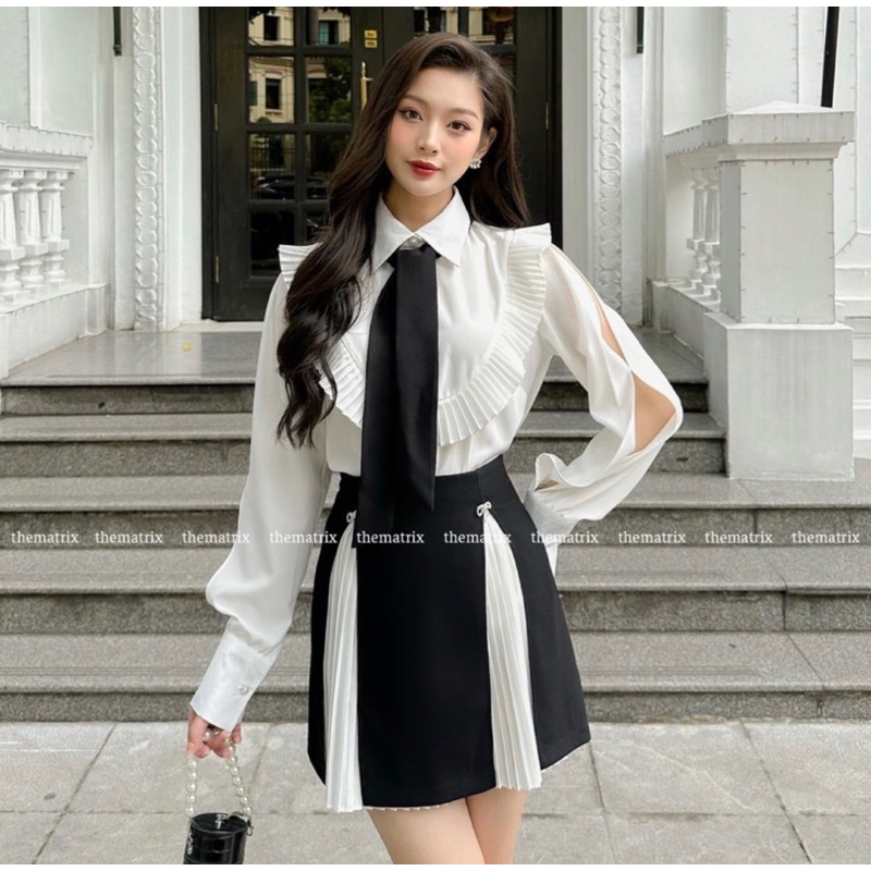 Mã Mới Sét Phối Đen Trắng Áo Sơ Mi Sẻ Tà Tay , Chân Váy Xếp Ly Trắng Tà Đen Tặng 2 cái Tang Đá