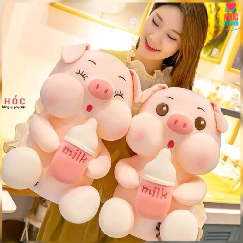 Gấu bông heo ôm bình sữa