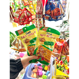 Bim bim, que cay, snack gậy như ý thiên long