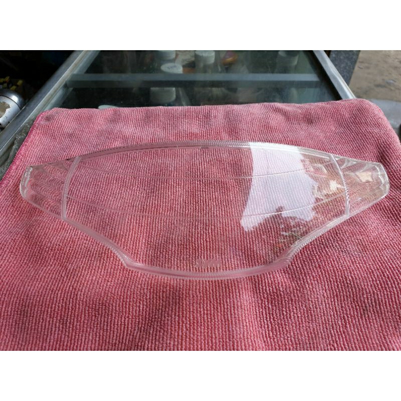 Kiếng chụp đèn pha SYM Angel100