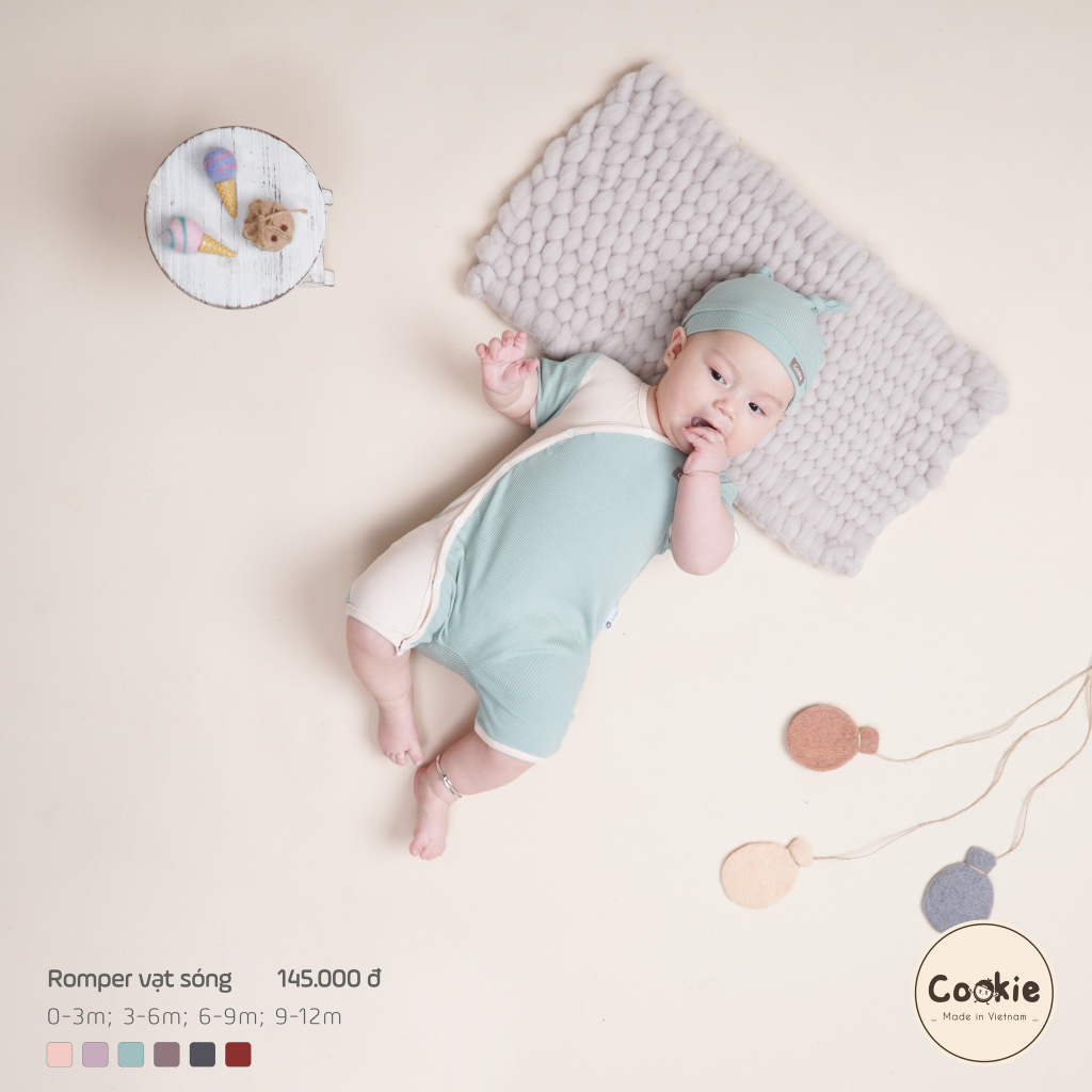 Cookie - Body cộc tay / Romper vạt sóng bấm khuy phối màu