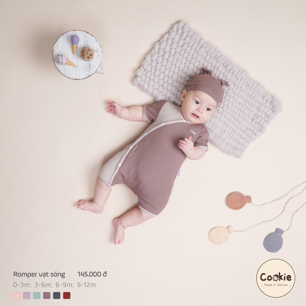 Cookie - Body cộc tay / Romper vạt sóng bấm khuy phối màu