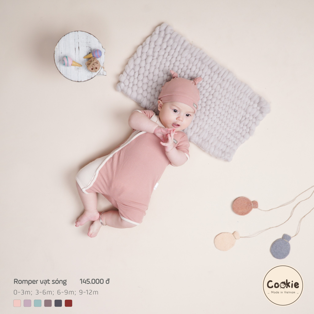 Cookie - Body cộc tay / Romper vạt sóng bấm khuy phối màu