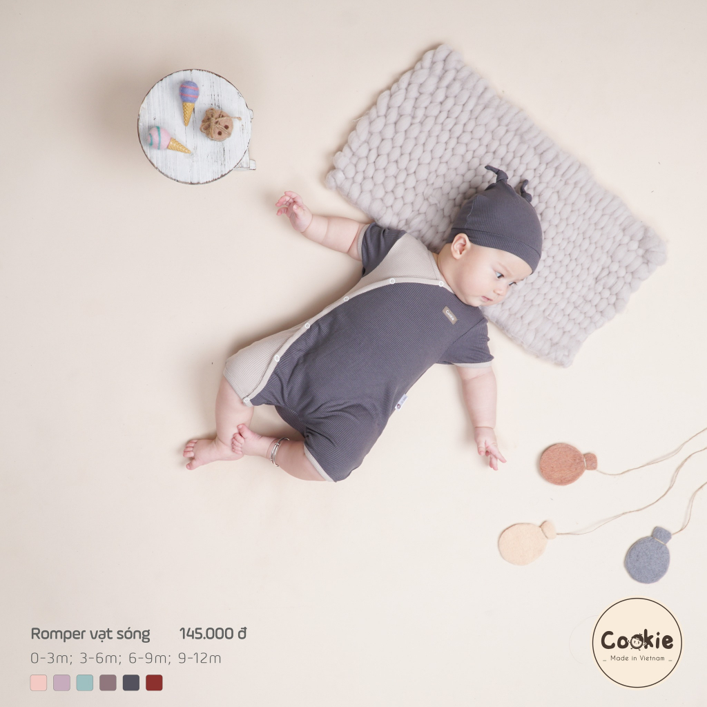 Cookie - Body cộc tay / Romper vạt sóng bấm khuy phối màu