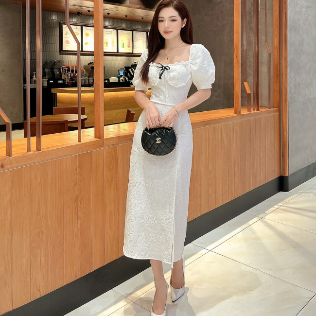 Đầm thiết kế trắng đen dáng dài tay bồng xẻ trước đính nơ