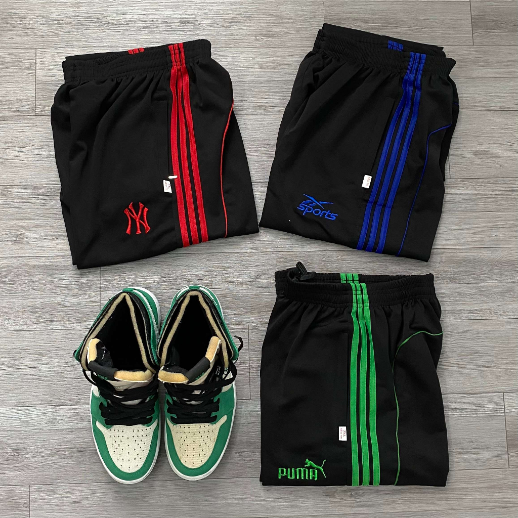 Quần dài thun Poly sọc viền dây kéo chân