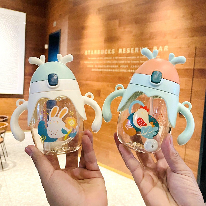 Bình tập uống nước chống sặc tai Thỏ 250ml có dây đeo cho bé