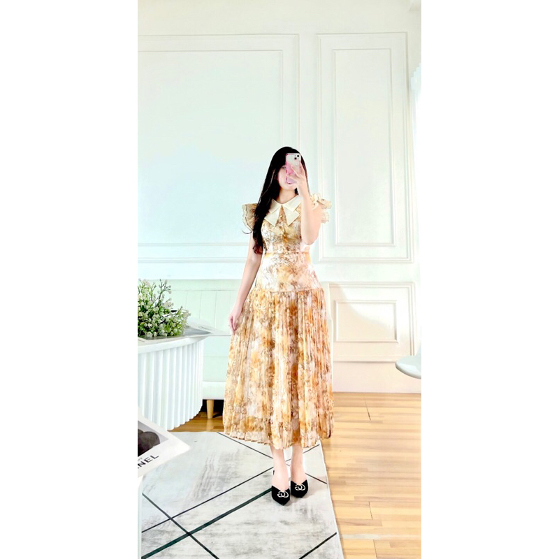 Đàm voan, cổ V phối nơ, tay tiên, tùng váy xếp ly
