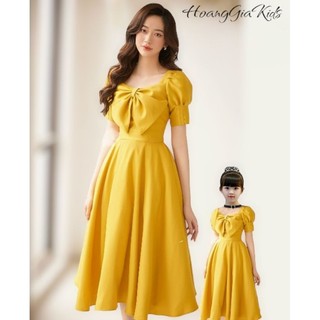Set mẹ và bé gái váy vàng nơ ngực