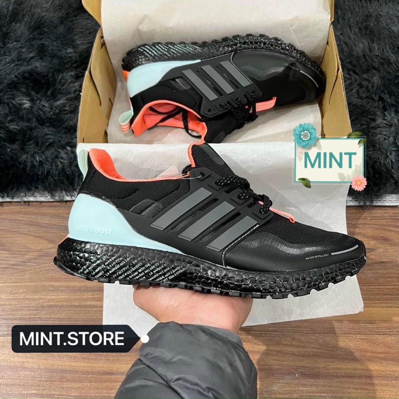 Giày sneaker ultraboost TRIP đen cam