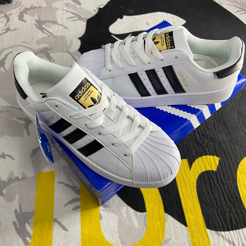 Giày _𝑨𝒅𝒊𝒅𝒂𝒔 𝑺𝒖𝒑𝒆𝒓𝒔𝒕𝒂𝒓 𝑴𝒖̃𝒊 𝑺𝒐̀, giày Sneaker trắng sọc đen nam nữ full phụ kiện