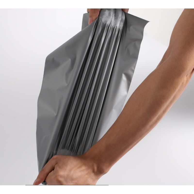 Túi gói hàng niêm phong sẵn keo dán miệng size 28x42 cuộn 100 túi màu ghi xám