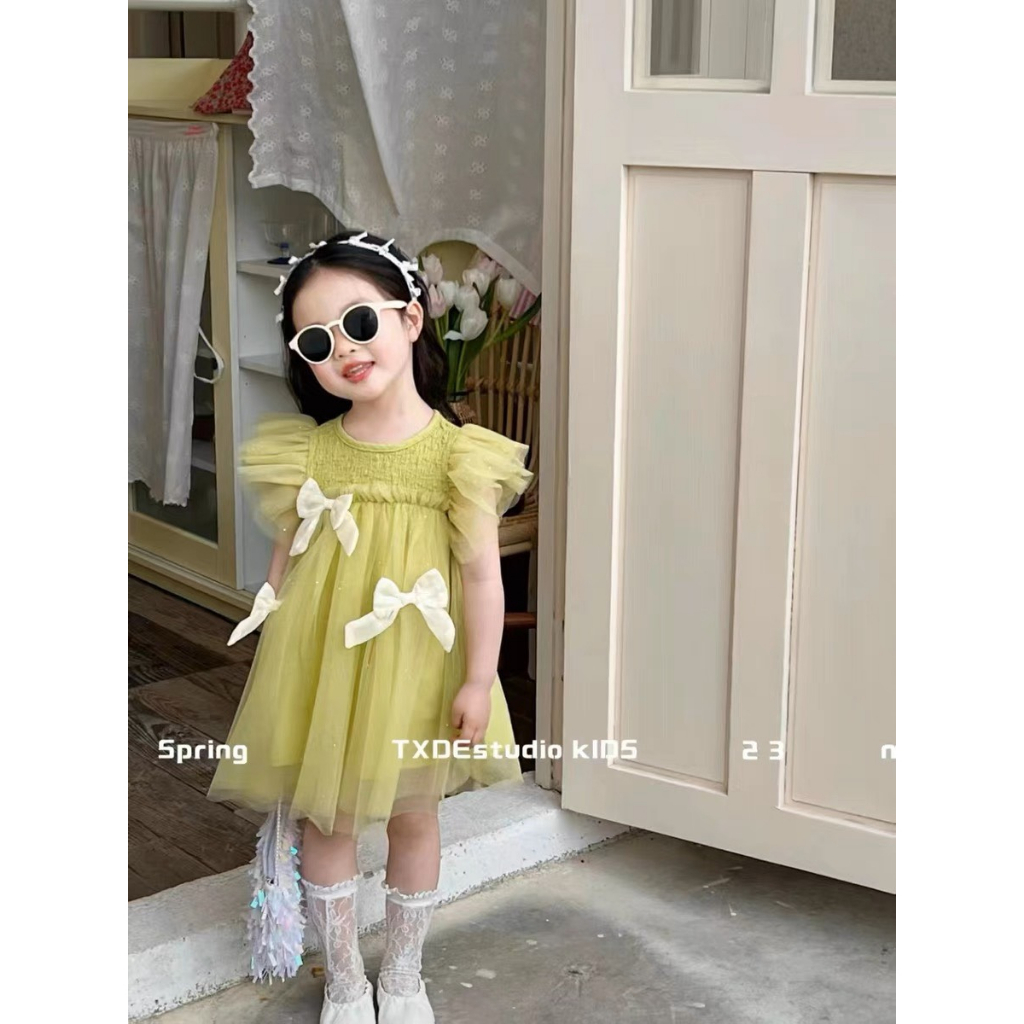 váy xanh nơ trước cho bé gái