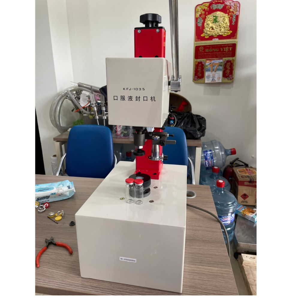 Máy đóng nắp lọ vacxin dùng điện, máy đóng nắp chai thuốc tiêm, thuốc vacxin 5ml 10ml 20ml 100ml KFJ 1035