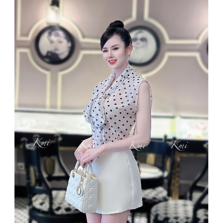 Set áo voan không tay chấm bi cách điệu nơ cổ phối chân váy A vạt xéo thời trang thiết kế công sở thanh lịch LEVAN