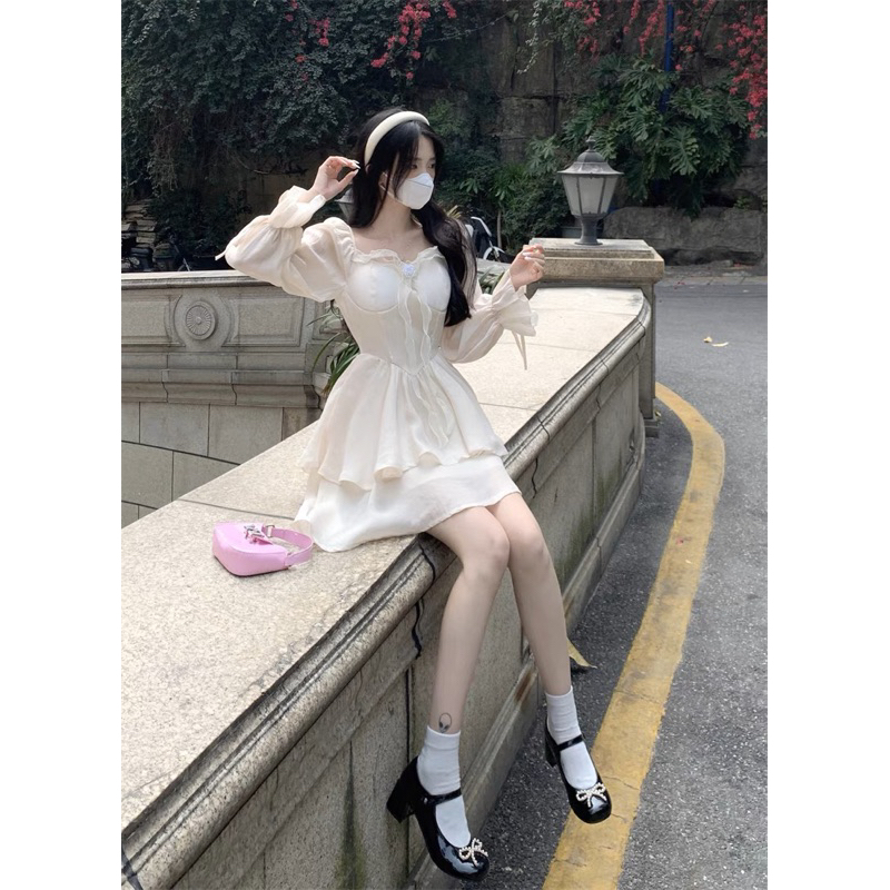 Đầm xoè công chúa kem vàng 2 tầng cột nơ đính tag hoa