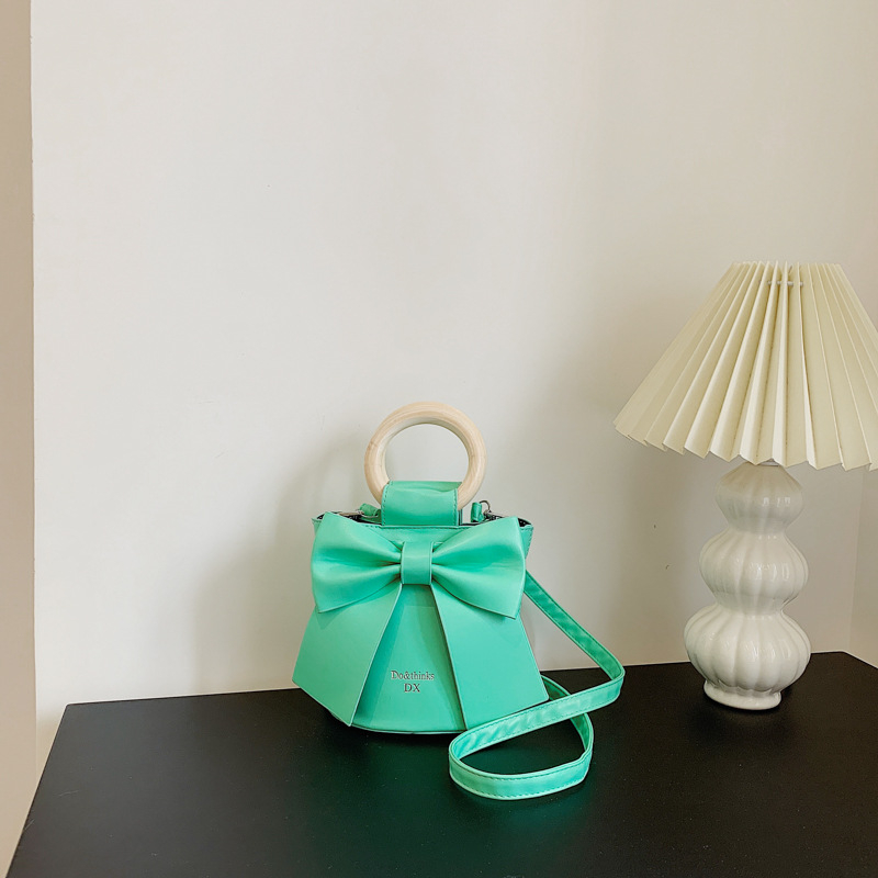 Túi xách đéo chéo, cầm tay, da PU gắn nơ xinh xắn cho nữ