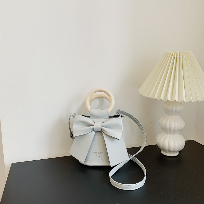 Túi xách đéo chéo, cầm tay, da PU gắn nơ xinh xắn cho nữ