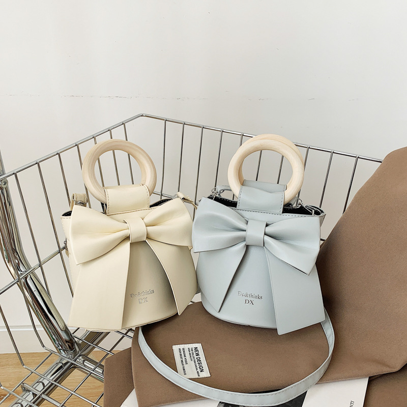 Túi xách đéo chéo, cầm tay, da PU gắn nơ xinh xắn cho nữ