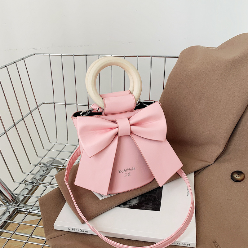 Túi xách đéo chéo, cầm tay, da PU gắn nơ xinh xắn cho nữ