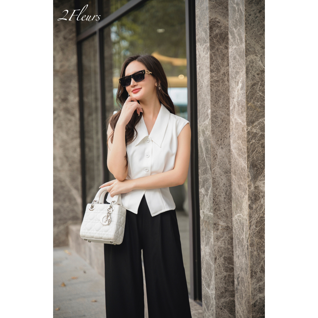 Set công sở Vivian 2Fleurs gồm áo sơ mi thiết kế tay hến cổ bẻ cách điệu xếp ly vai cùng quần suông đen xếp ly eo thanh
