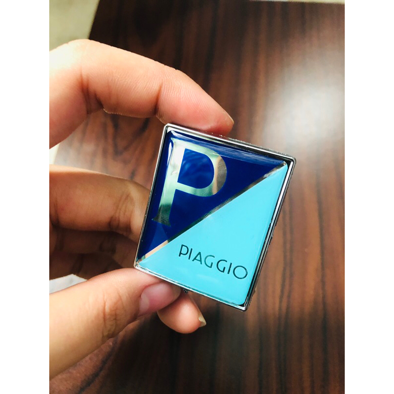 Logo Mặt Nạ Vespa “Piago” Xanh Xi