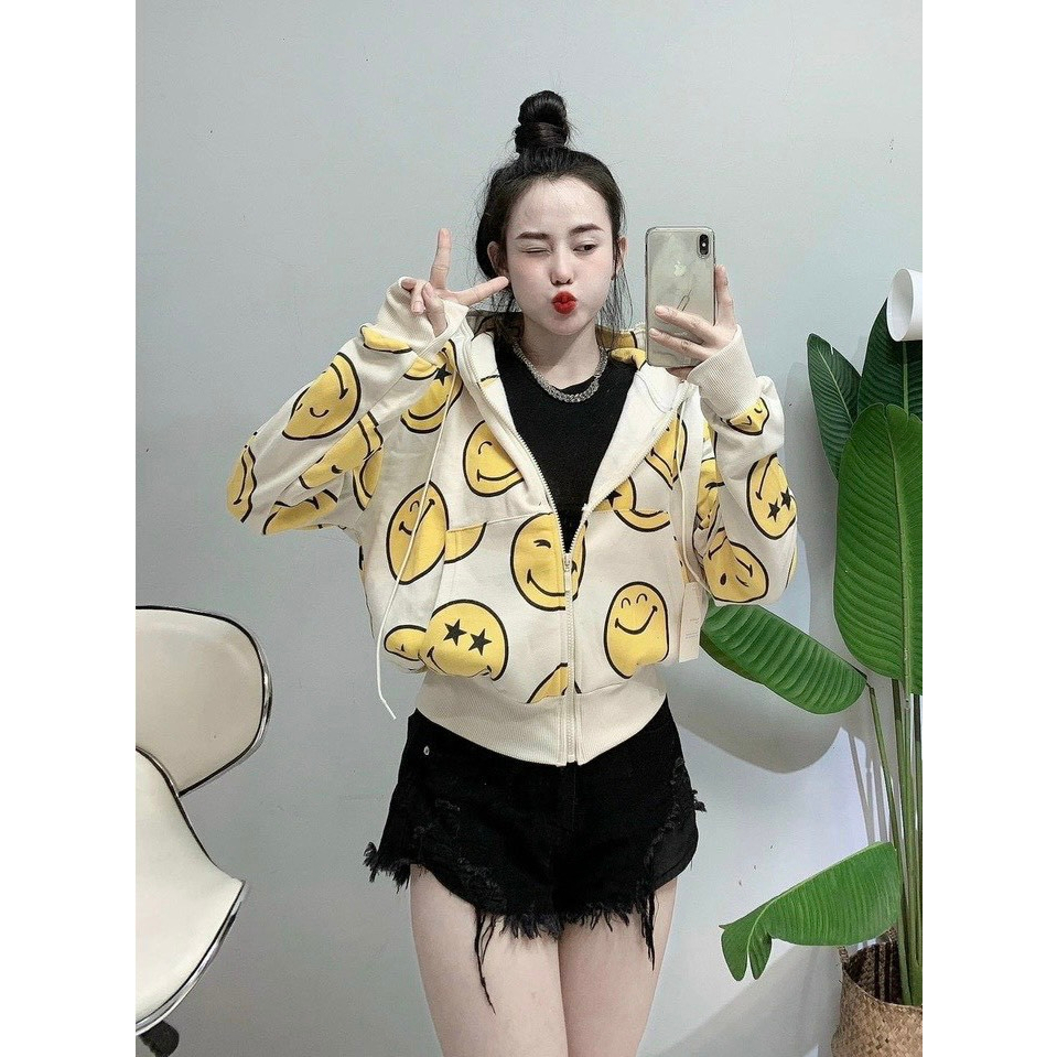Áo khoác nỉ khoá kéo , nón trùm đầu vành rộng che chắn tốt họa tiết mặt cười , form dáng lửng .
