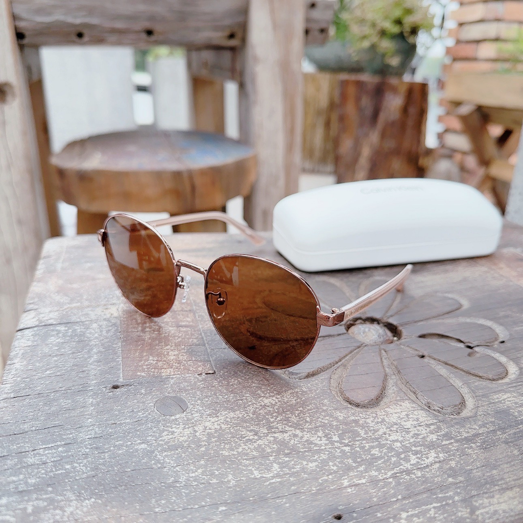 Kính mát Calvin Klein dáng tròn, gọng rose gold, mắt nâu trà CK18301SK 781