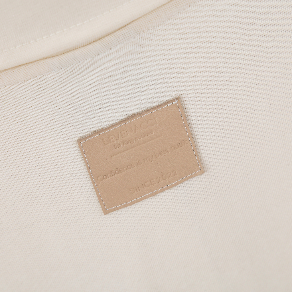 Áo Polo Màu Kem - Thêu Logo - Mác Da Bò Thật Thủ Công