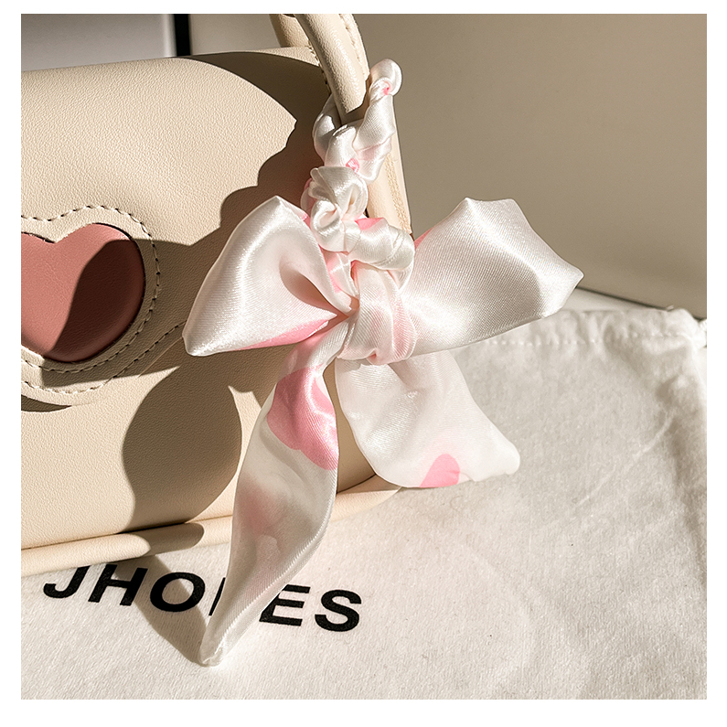 Túi đeo chéo nắp gập thiết kế yên ngựa kèm nơ lụa