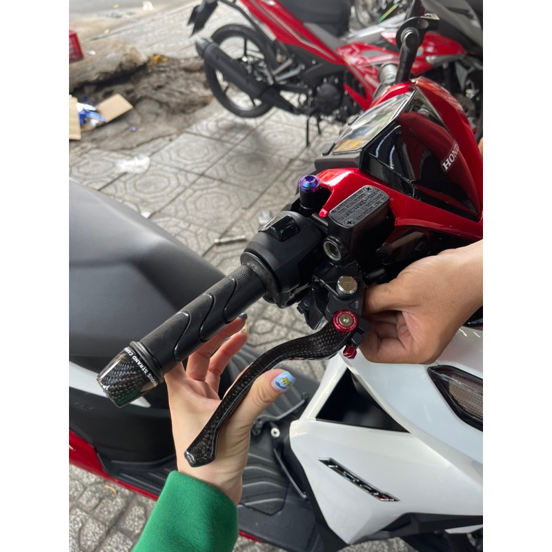 Gù Carbon chống rung tay lái