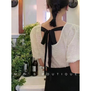 Áo sơ mi nữ cộc tay phồng màu trắng thắt nơ đen sau lưng điệu đà mùa hè công sở nhẹ nhàng Hàn Quốc
