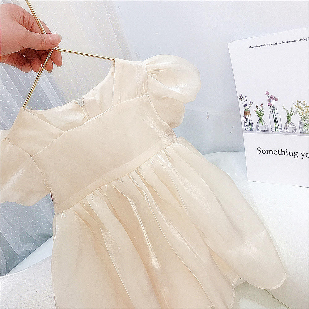 Đầm hè bé gái màu kem thiết kế tay bồng chất voan lụa quảng châu