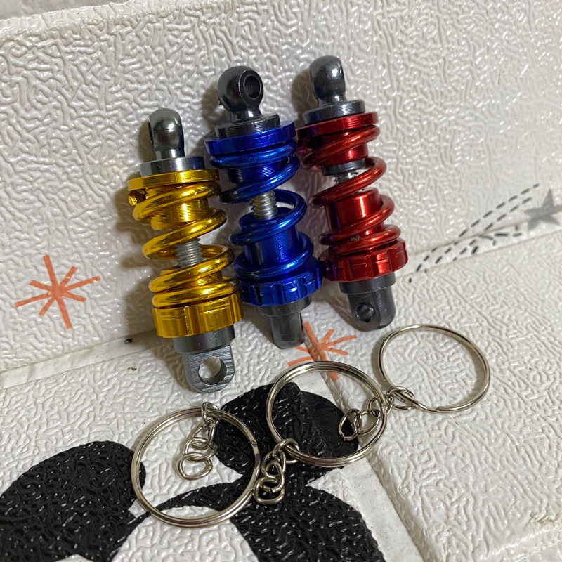 Móc khoá cây phuộc nhôm cnc