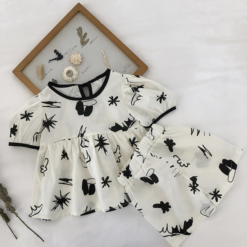 Bộ đồ đi biển bé gái DINOKING Set áo baby doll tay bồng + quần short họa tiết cá tính chất lanh cotton mềm mịn DB36