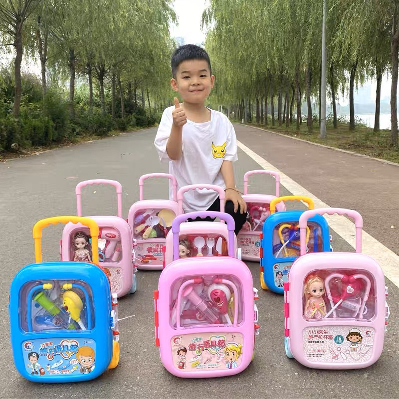 Đồ chơi vali kéo trang điểm màu hồng có búp bê cho bé