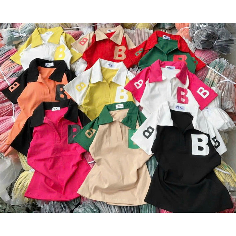 Áo thun cổ trụ tay ngắn phối chữ dáng dài