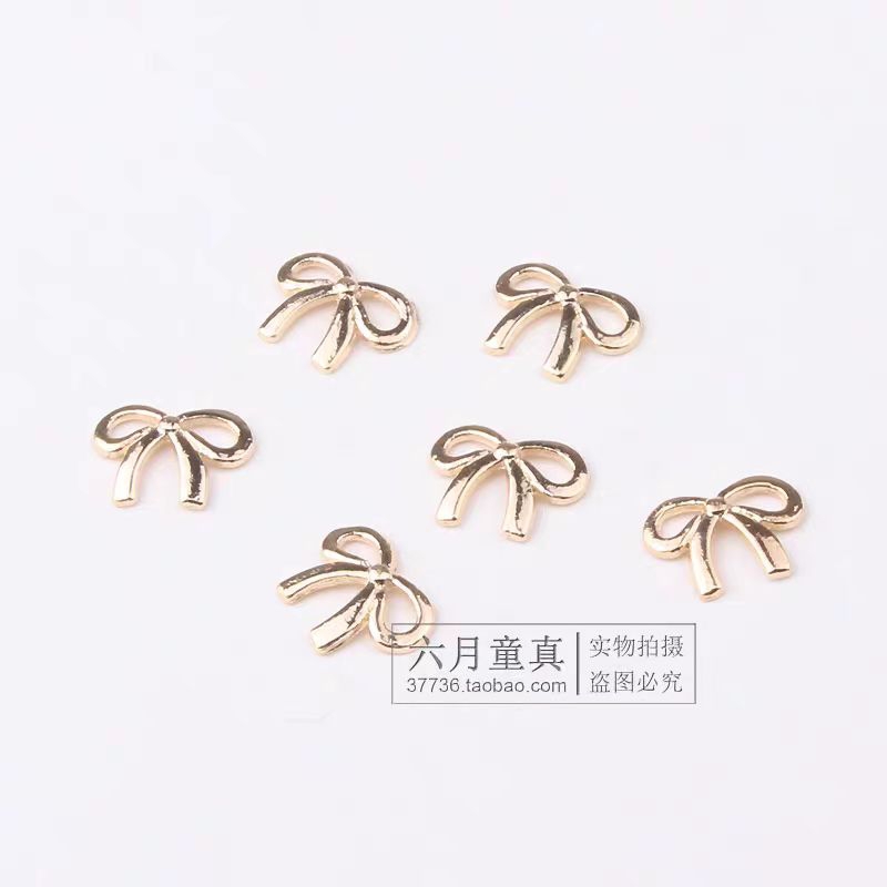 Charm nơ vàng nail,charm nơ trang trí móng kim loại