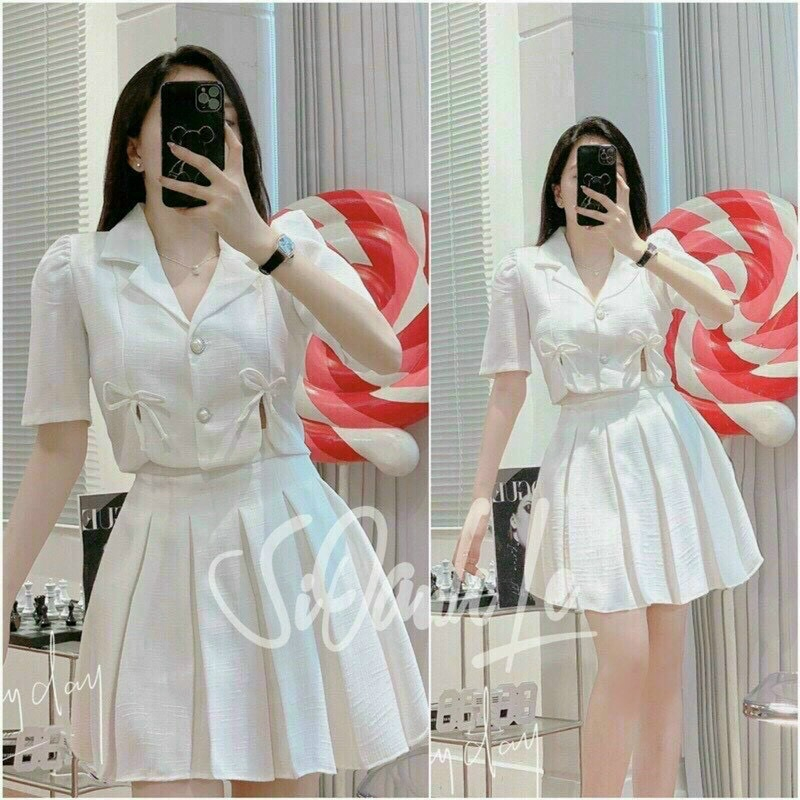 Set bộ linen 2 món, áo vest tay ngắn dáng croptop phối nơ kèm chân váy xếp ly có lót trong siêu xinh