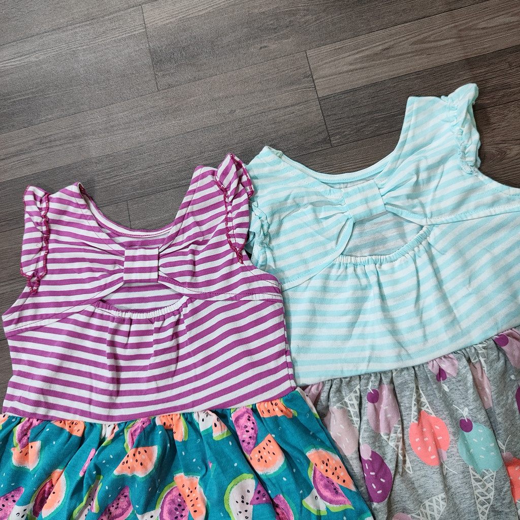 Váy xuất dư kẻ họa tiết tay cánh tiên bé gái