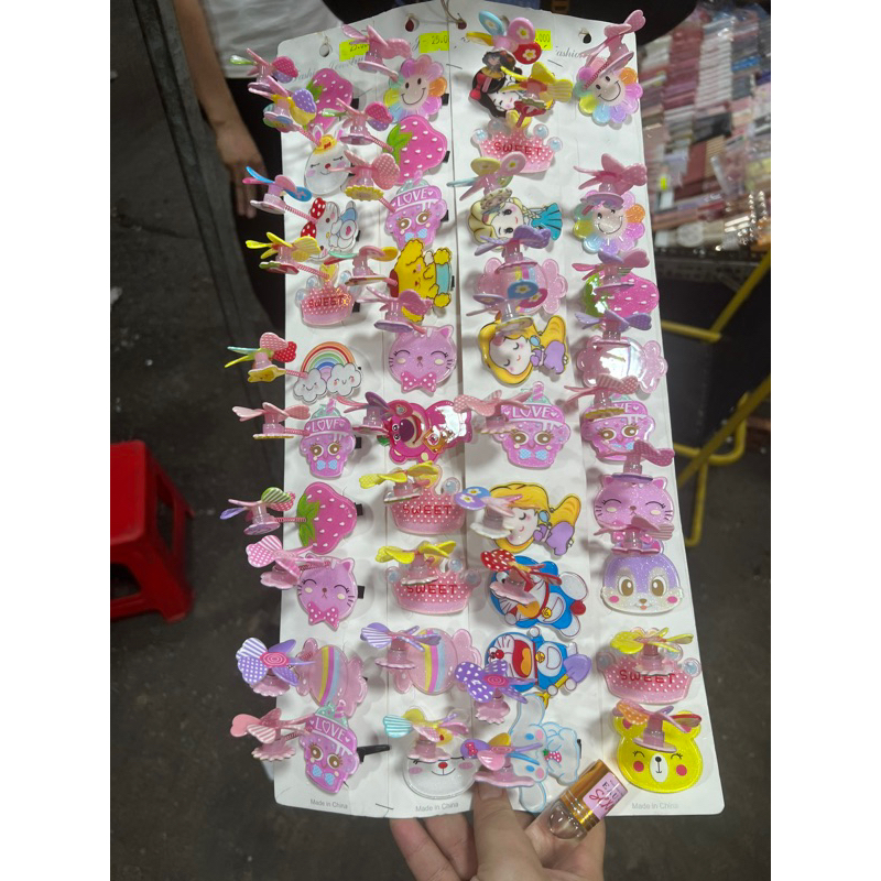 kẹp tóc lò xo chong chóng