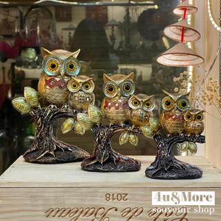 Tượng cú mèo đậu gốc cây nhũ vàng