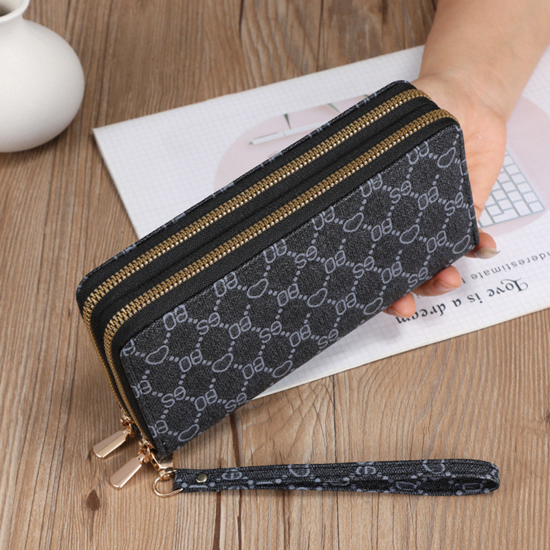 Ví nữ dài cầm tay NEW-0081 với 2 ngăn kéo sang trọng, thiết kế hoạ tiết và màu sắc mới cực dễ thương, sành điệu, bền đẹp