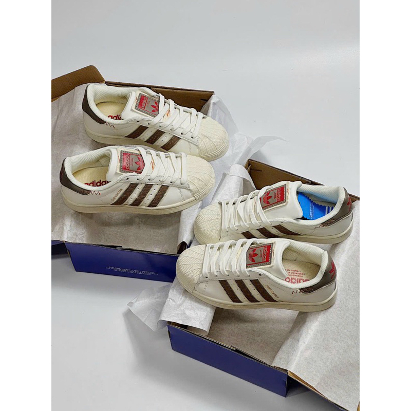 Giày sneaker superstar kem nâu viền đỏ