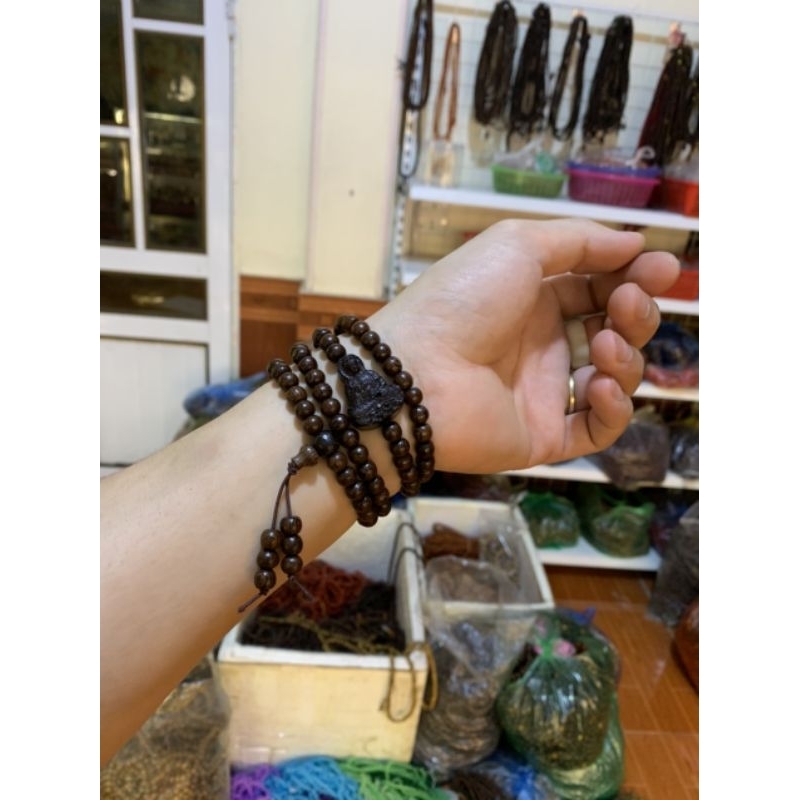 Vòng gỗ mun công mix mặt quan âm