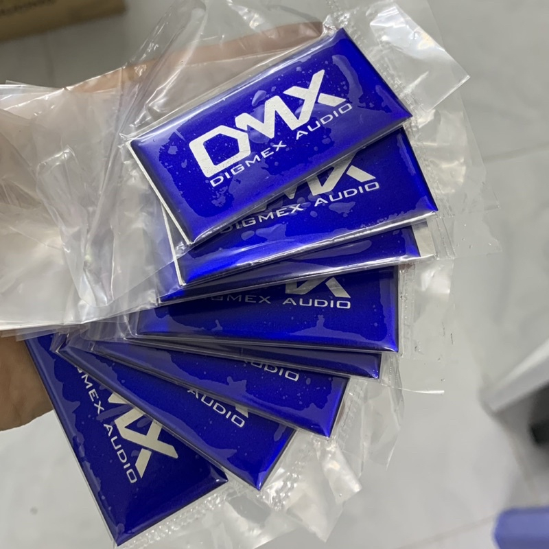 Tem logo DMX, giá 2 cái, kích thước 6cm x 3cm.